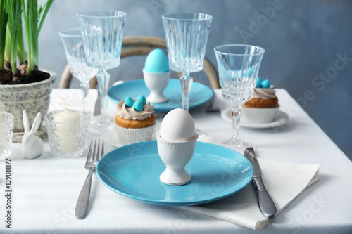 Beautiful Easter table setting with blue plate