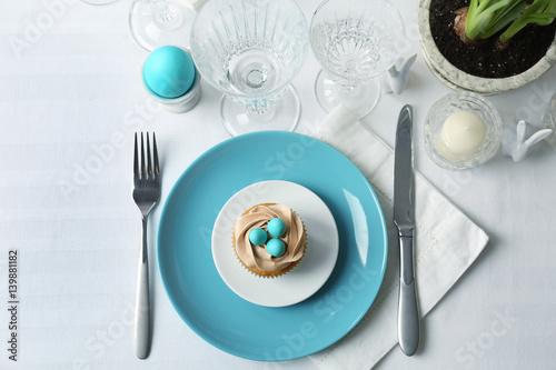 Beautiful Easter table setting with blue plate