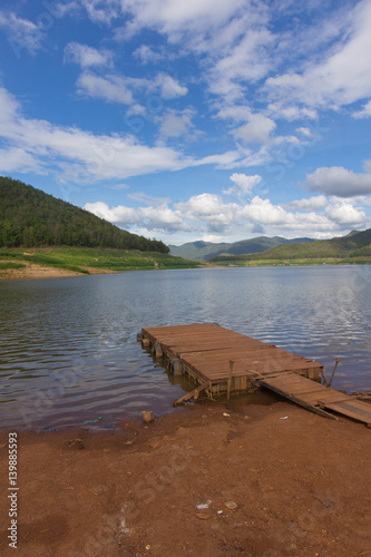 wood Pontoon boat  with Mae Ngad Dam and Reservoir in Mae Taeng , Chiang Mai  Thailand photo