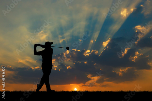 silhouette golfer playing golf during beautiful sunset