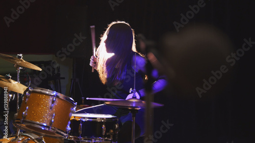 Photography Girl rock musician - female drummer performing