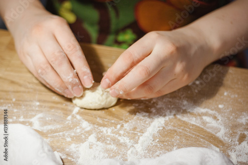 Woman preparing flour product - pie