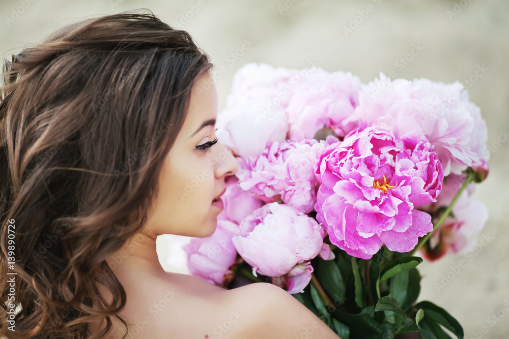 outdoor portrait of a beautiful woman with flowers