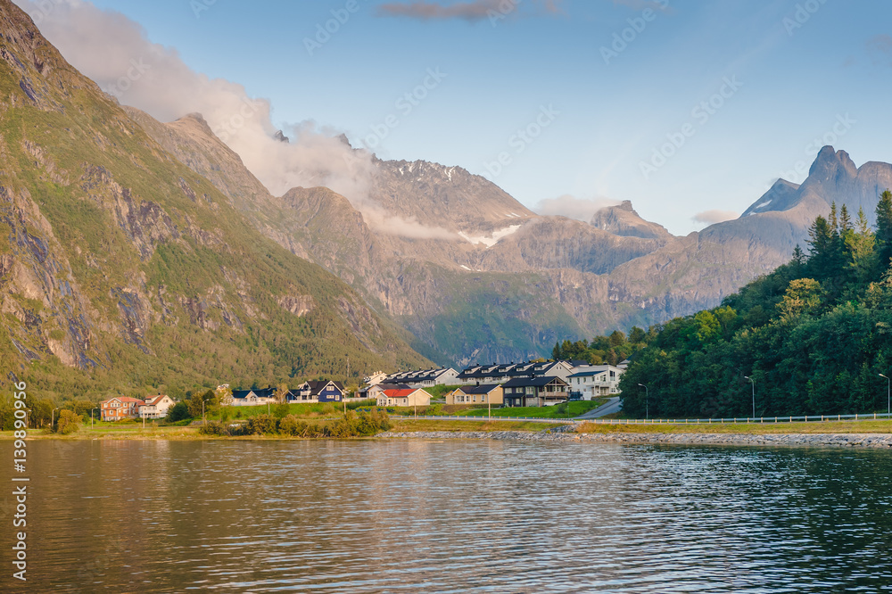 Warm summer evening in the mountains against the backdrop of the lake. Norway
