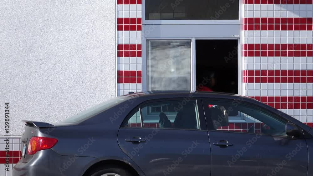 Driving through a fast food drive thru