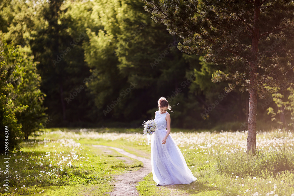 Beautiful woman enjoying lilac garden, young woman with flowers in green park. Beautiful woman enjoying lilac garden, young woman with flowers in green park.