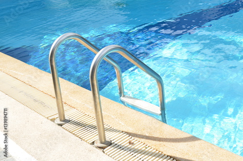 Swimming pool with stair at...