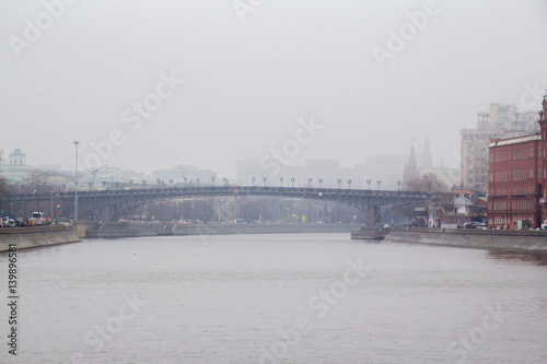 Foggy spring morning on the embankment of the river © Vladimir