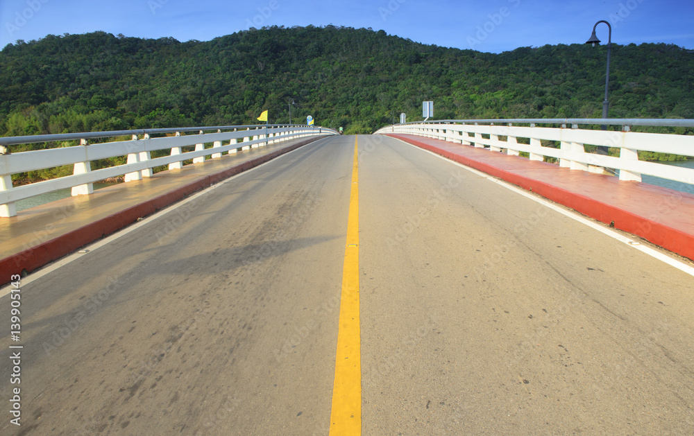 Asphalt road and mountain with blue sky Asphalt road and mountain with blue sky