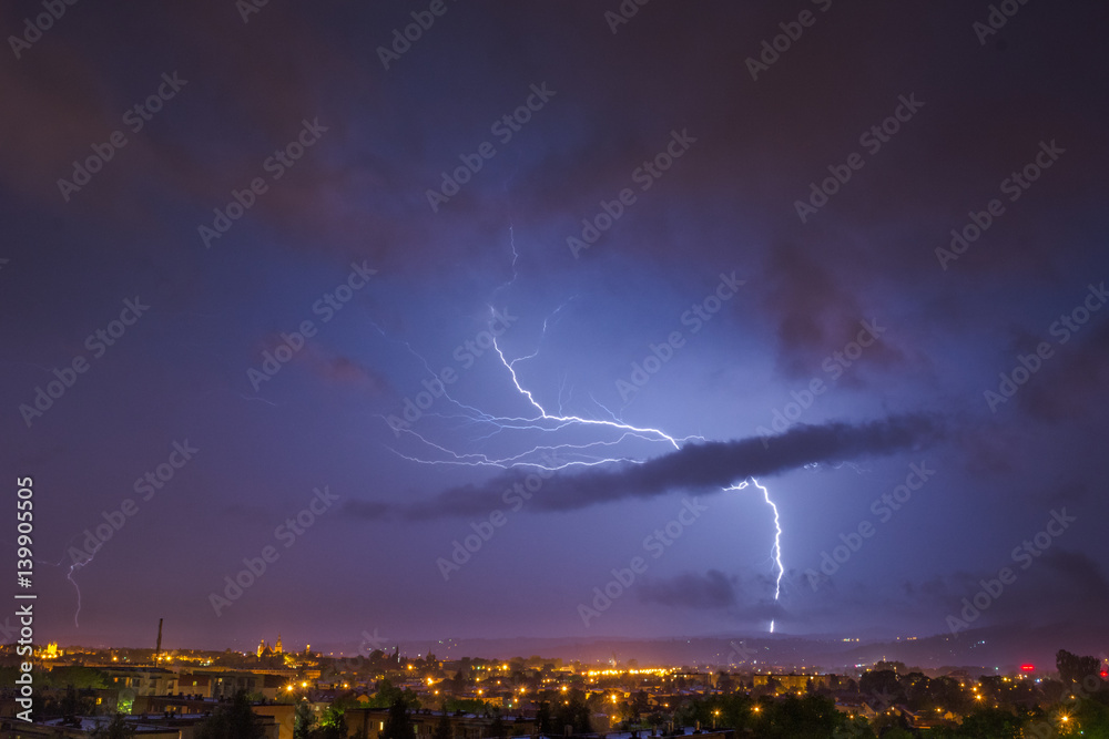 storm at night over the city (lightning bolt)