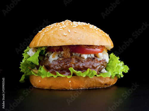 Tasty and appetizing hamburger isolated black