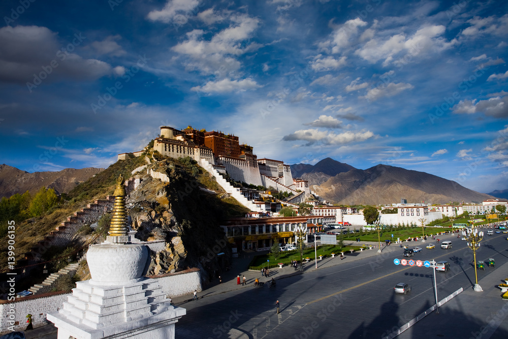 Front of Tibetan Potala Palace Stupa and Road in Lhasa, Tibet on a blue sky day