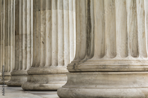 Colonnade of  Ionic order columns, close up. photo