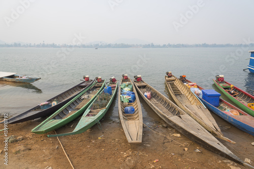 Ubon Ratchathani, Thailand - Feb 2 2016 : An unidentified people are taking boat for crossing at border of Thailand and Lao at Ubon Ratchathani province in Thailand photo