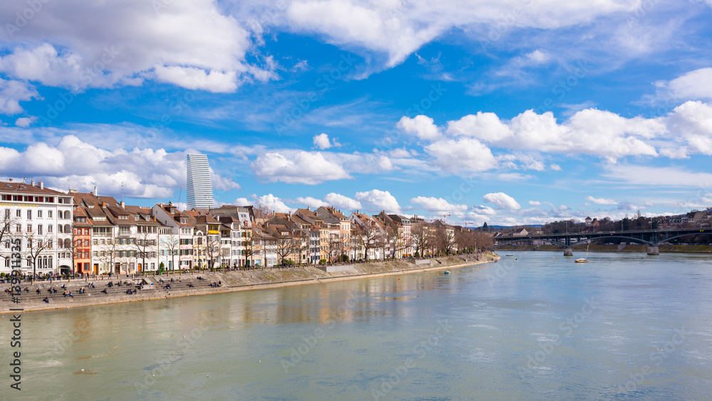 View of Basel, Switzerland with old medieval buildings, river Rhine and Roche tower in the background