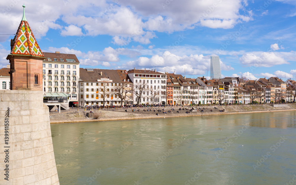 View of Basel, Switzerland with old medieval buildings, river Rhine and Roche tower in the background