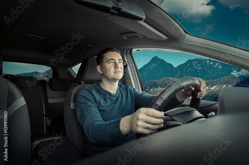 Man is traveling by car