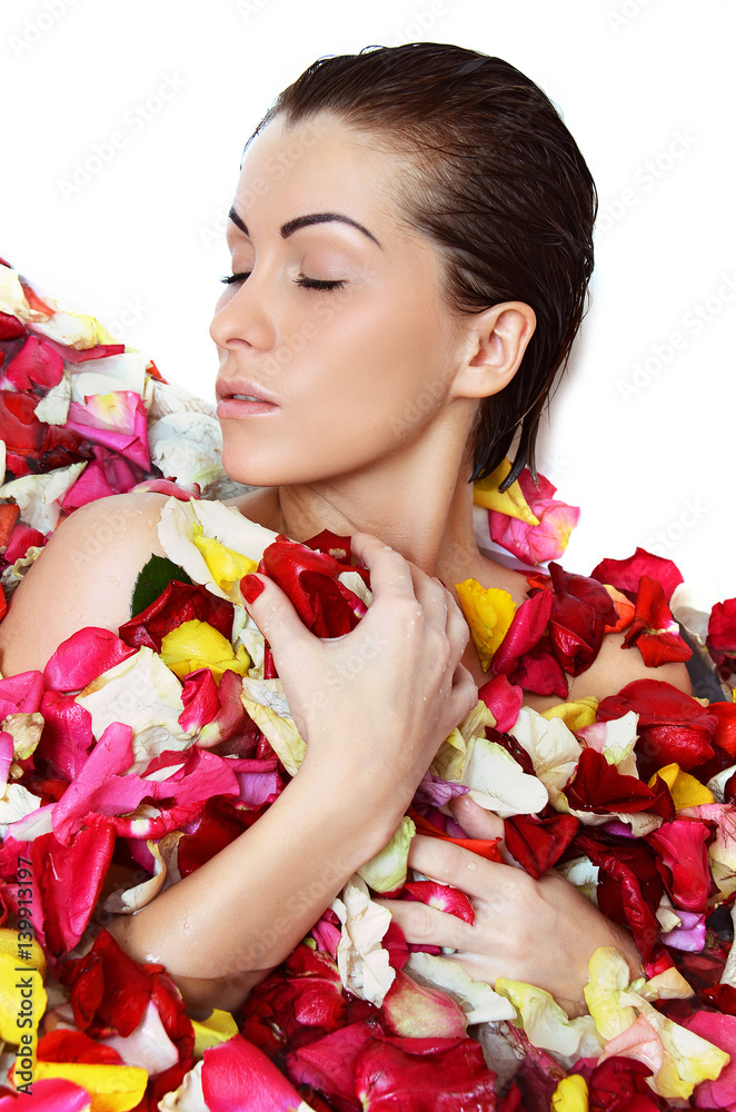 Fototapeta premium Beautiful female in bath with rose petal. Body care.