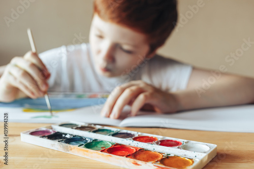 The boy paints
