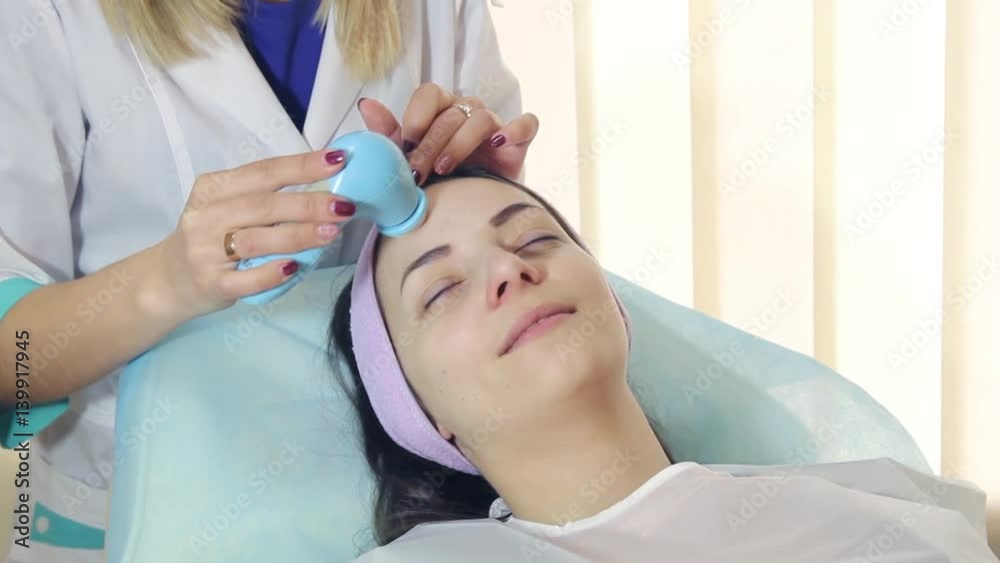 face massage in Spa salon. Massager Brush for face face massage in Spa salon. Massager Brush for face