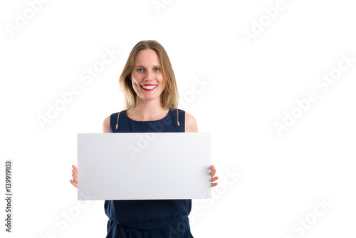 Smiling woman holding a blank white board to present something