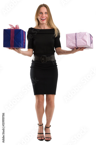 Attractive woman juggling big gift packages, isolated on white