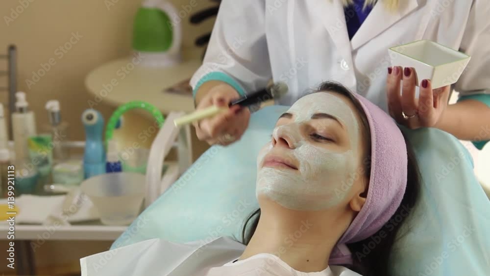 Young woman in a spa with facial mask. Woman in spa salon Young woman in a spa with facial mask. Woman in spa salon