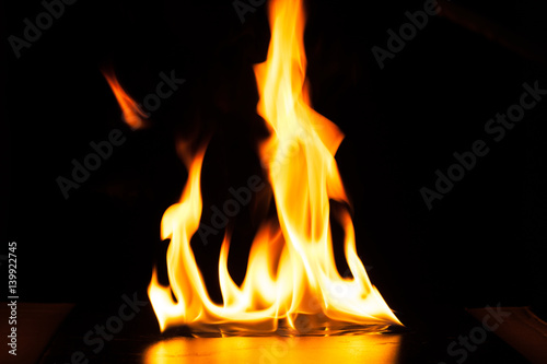 Burning fire flame on black background © nopparats