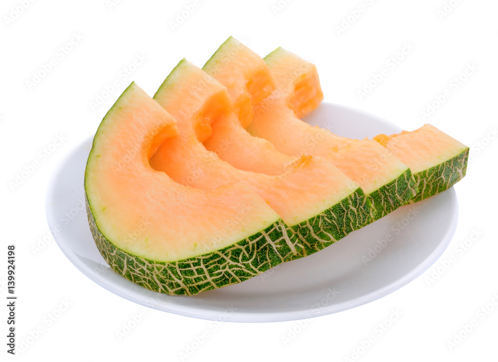orange cantaloupe melon slices in white plate isolated on white background orange cantaloupe melon slices in white plate isolated on white background