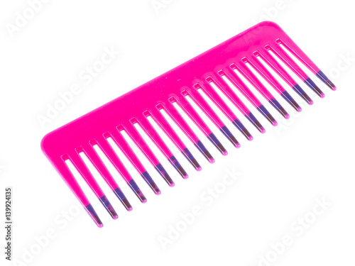 Pink comb on white background