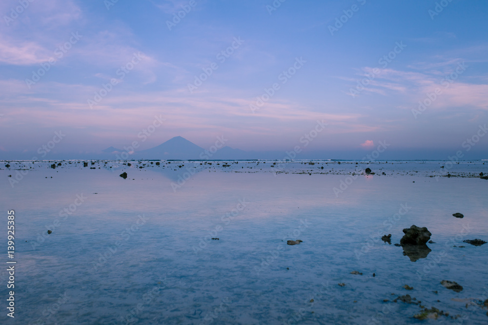 The view of the volcano Agung from Gili Trawangan in the early morning at low tide The view of the volcano Agung from Gili Trawangan in the early morning at low tide