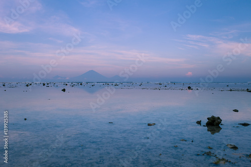 The view of the volcano Agung from Gili Trawangan in the early morning at low tide photo