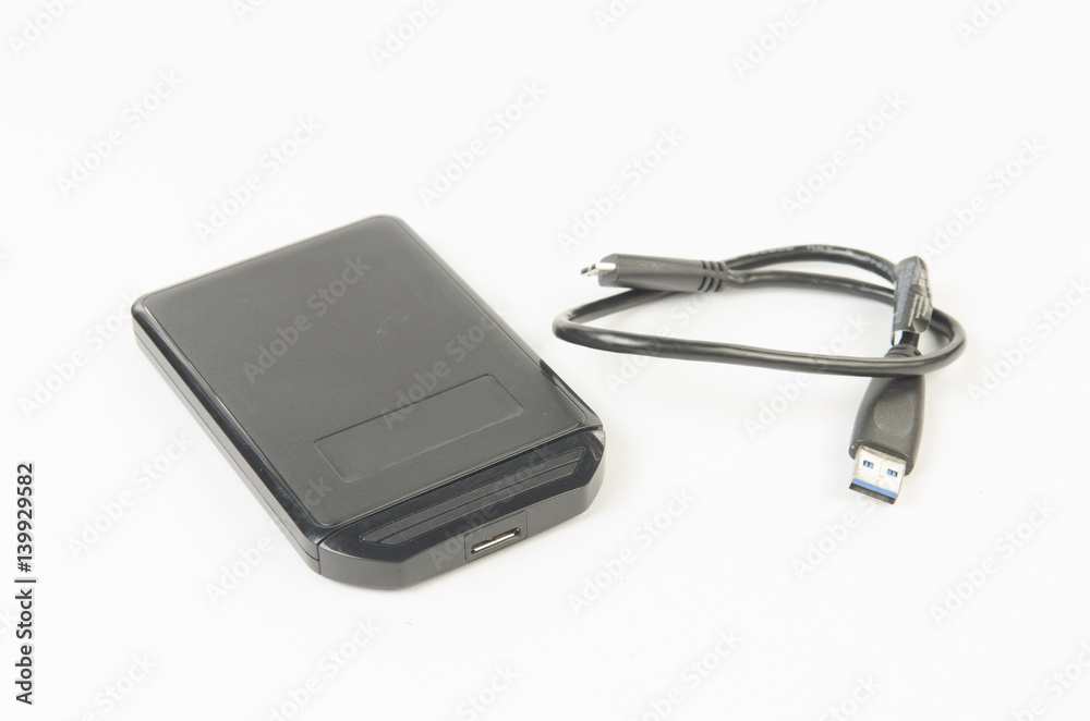 Portable external HDD hard disk drive with USB cable on white background Portable external HDD hard disk drive with USB cable on white background