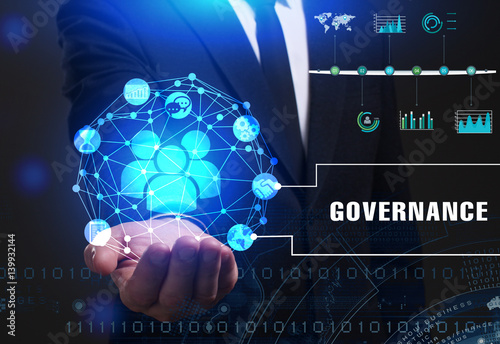 Business, Technology, Internet and network concept. Young businessman working on a virtual screen of the future and sees the inscription: Governance