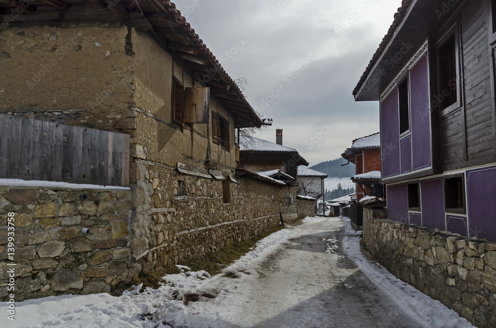 Antique cobblestone street with beauty ancient houses, town Koprivshtitsa, Bulgaria 