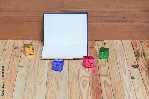 Christmas day with  gift  happy new year  on  wooden background