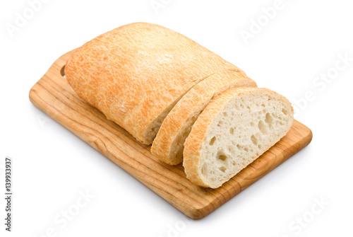 Fresh bread ciabatta on a wooden board