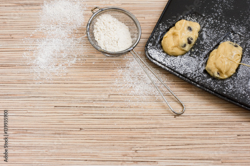 Make cookies. Form for baking French madeleine cookies and strainer with flour. The dough in a baking dish. How to make pastry. Step by step. Copy space