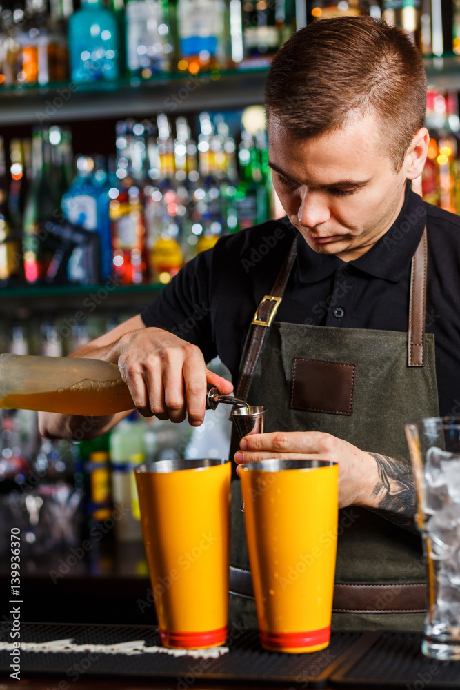 The bartender making cocktail
