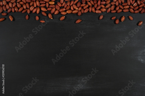 Peanuts on black chalkboard.