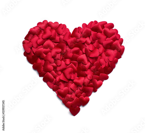 Red heart shape made of many small confetti hearts isolated on white background