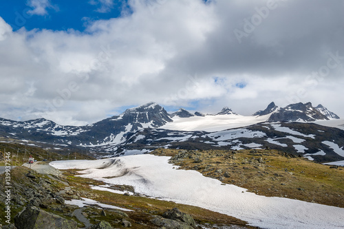 Road in the snowy rocky mountains, Norway.