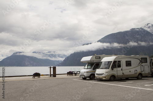 Camping holidays car on the parking near norwegian fjord, norway photo