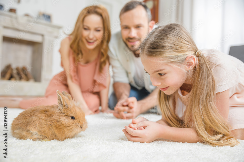 Happy family with rabbit Happy family with rabbit