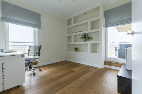 Office with wooden floor