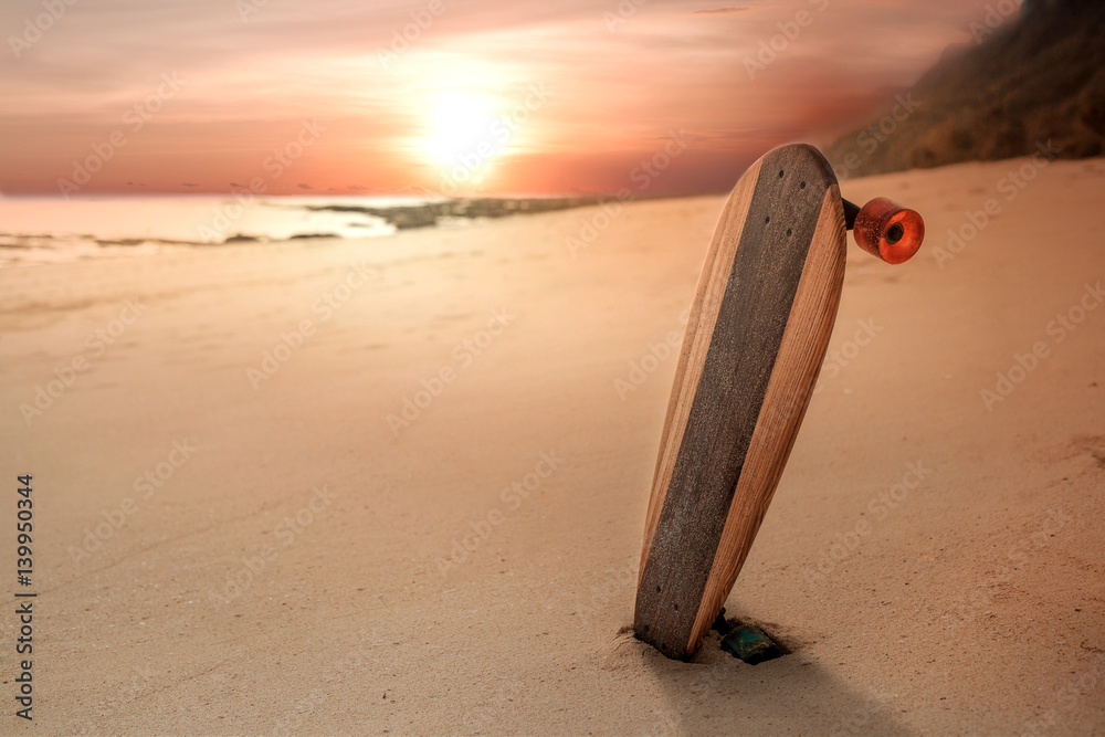 skateboard on the beach at sunset, youth and freedom concept skateboard on the beach at sunset, youth and freedom concept