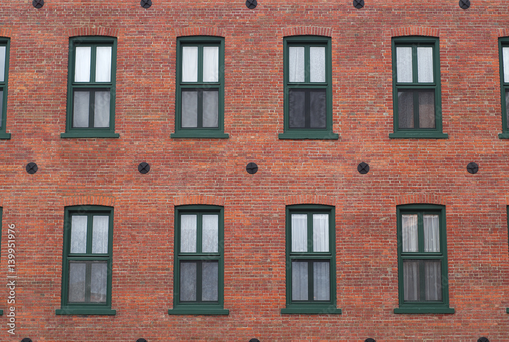red brick wall windows residential building facade