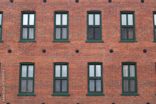 red brick wall windows residential building facade