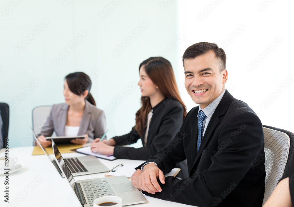 Business partners discussing documents and ideas at meeting Business partners discussing documents and ideas at meeting