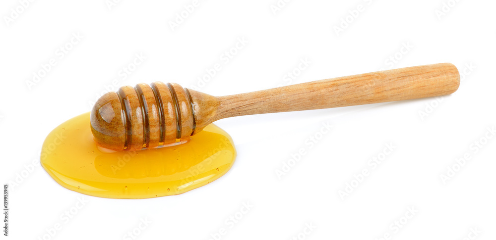 Wooden honey dipper with honey Wooden honey dipper with honey